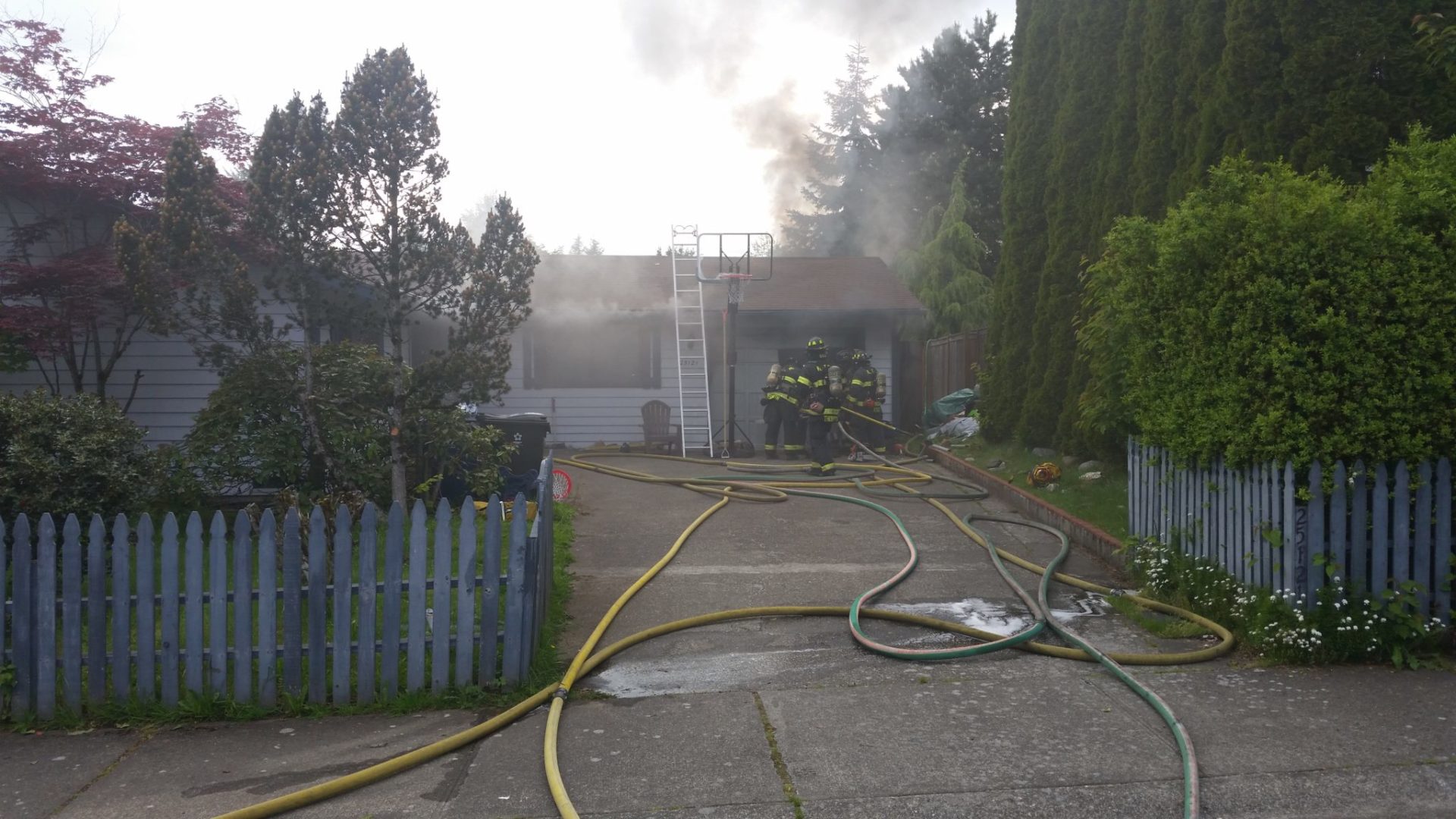 Firefighters respond to a fire in a converted garage on Kent's East Hill Thursday.