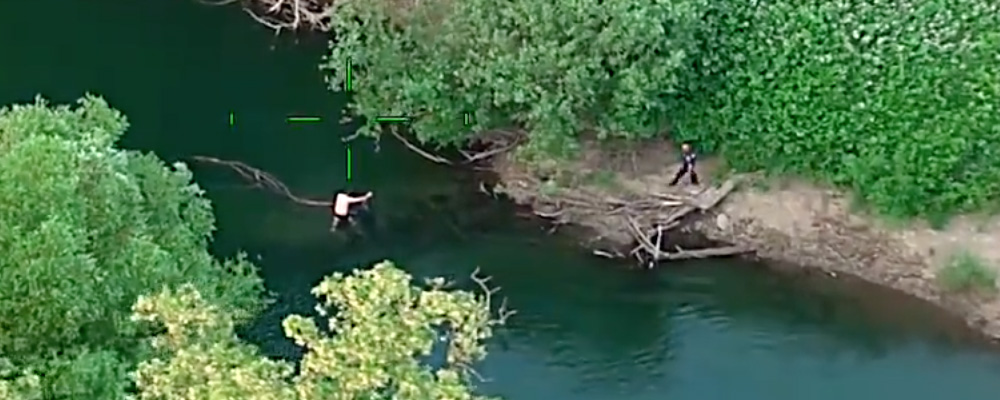 VIDEO: Hit & run suspect who pulled gun tries to swim away from police